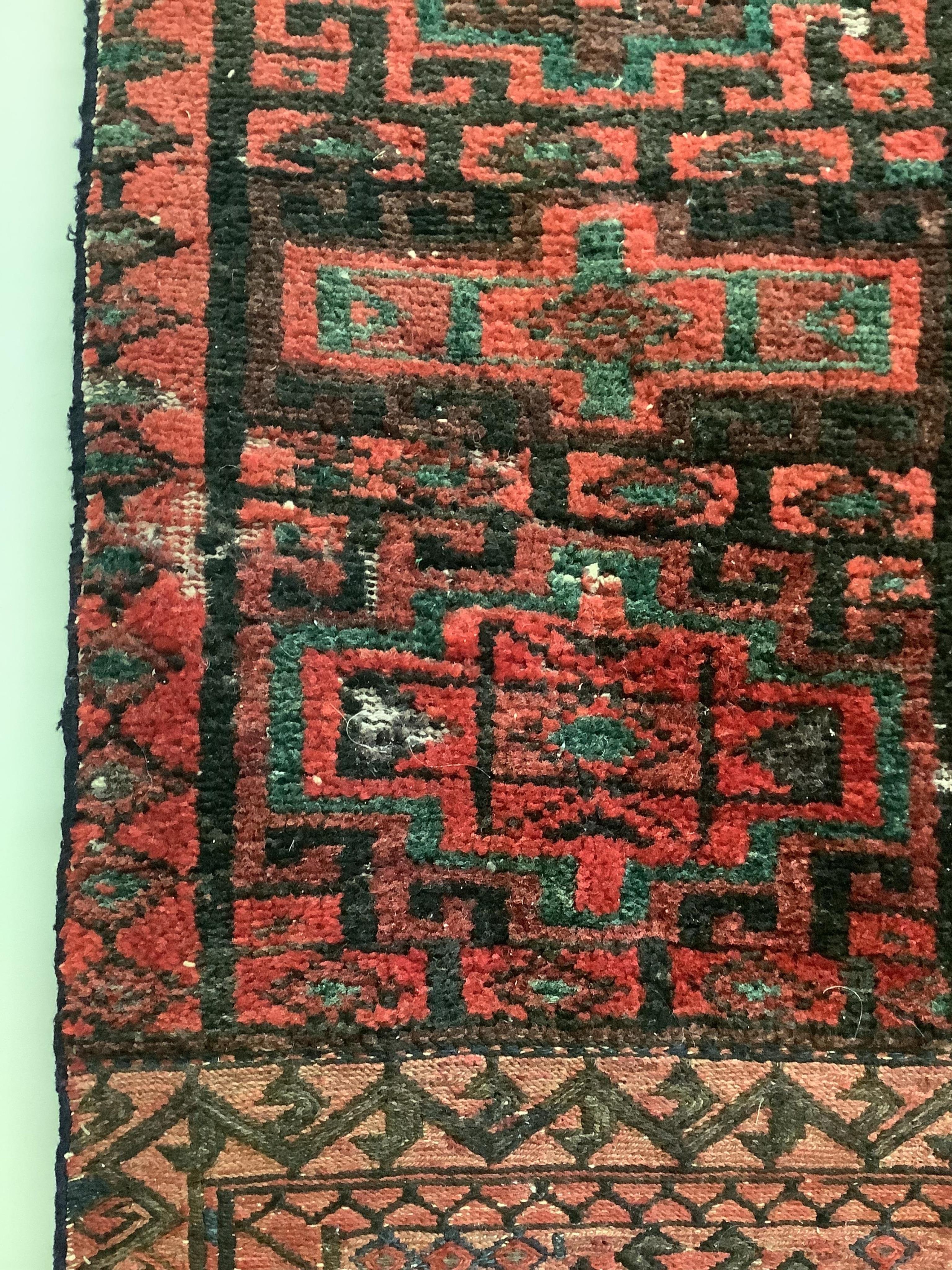 A saddlebag sampler carpet, 222 x 92cm. Condition - fair